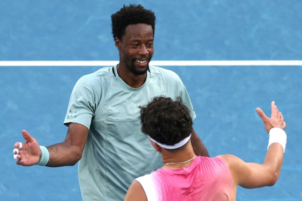 France's Gael Monfils (top) congratulates USA's Ben Shelton after their Australian Open match