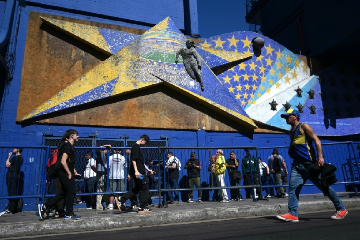 Fans of late Argentine coach Miguel Angel Russo queue outside la Bombonera stadium to attend his wake in Buenos Aires