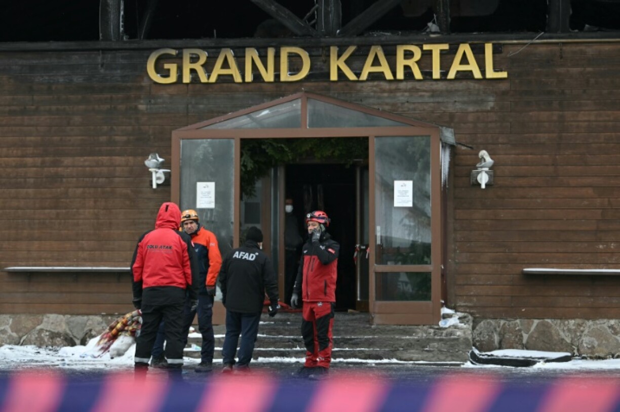 Working in freezing cold fog, Turkish rescuers were combing through the charred wreckage of the Grand Kartal Hotel