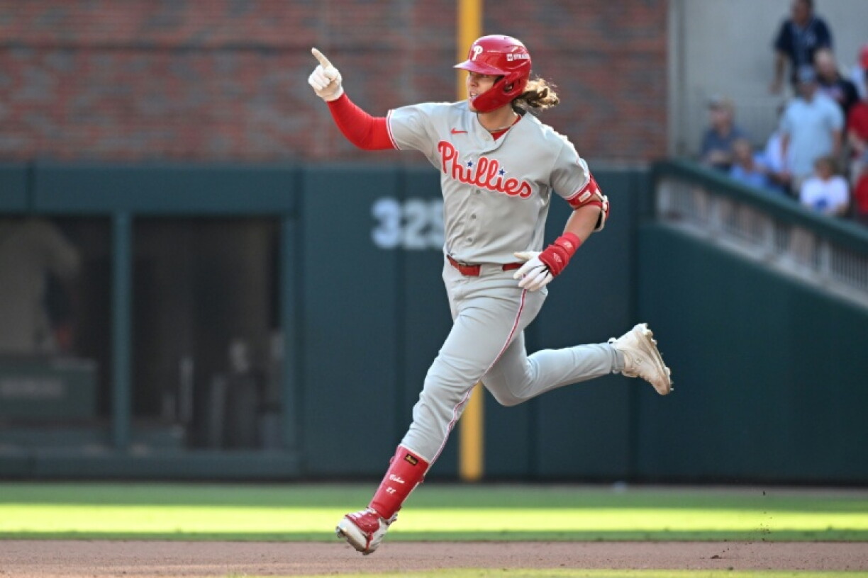 Philadelphia's Alec Bohm runs the bases after smashing a game-winning 10th-inning home run that gave the Phillies a 4-3 win at Atlanta to level their MLB playoff series