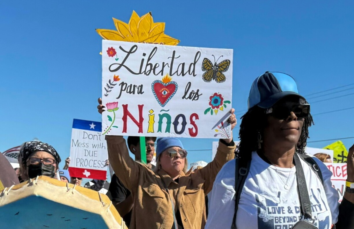 A protester calls for children to be freed from an immigrant detention facility in Dilley, Texas