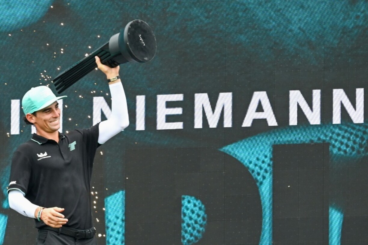 Chile's Joaquin Niemann of Torque GC team lifts the trophy after winning the individual final round of the LIV Golf Singapore