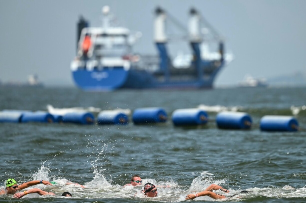 Swimmers compete in the men's 10km in the sea off Singapore