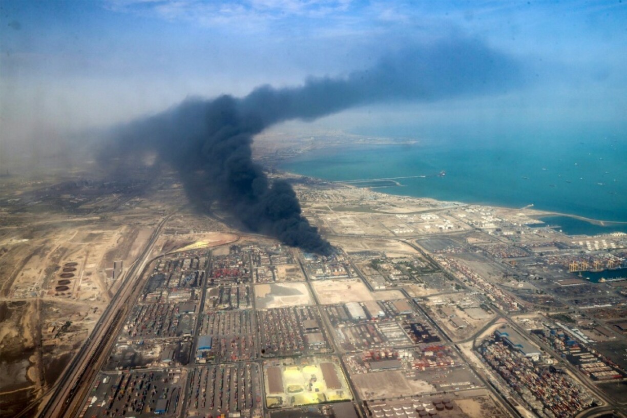 Heavy smoke rises from the scene of a deadly port blast and fire a day earlier, a picture provided by the media office of the Iranian presidency shows