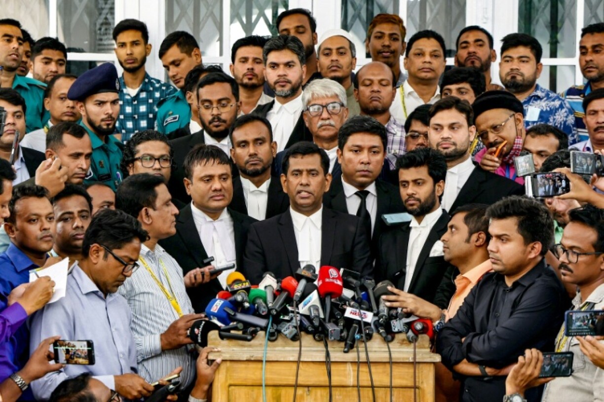 Chief prosecutor of Bangladesh's International Crimes Tribunal (ICT) Mohammad Tajul Islam (C) said Hasina faces at least five charges