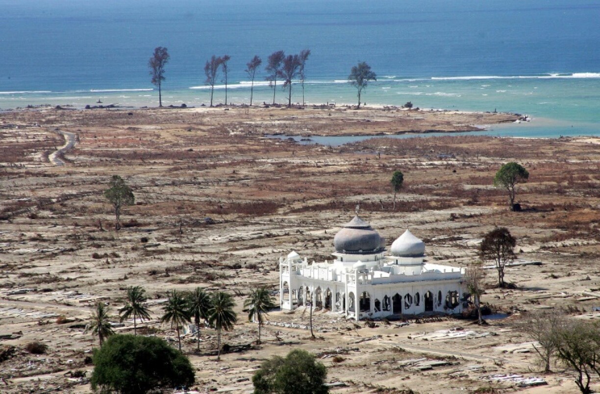 A mosque sits in the middle of the devastated town of Banda Aceh after the December 2004 tsunami