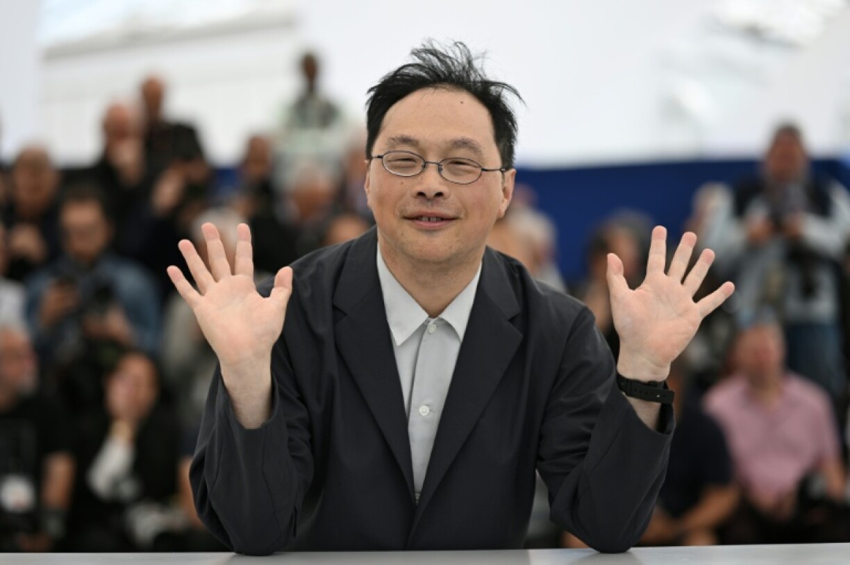 Koji Fukada poses for photographers in Cannes
