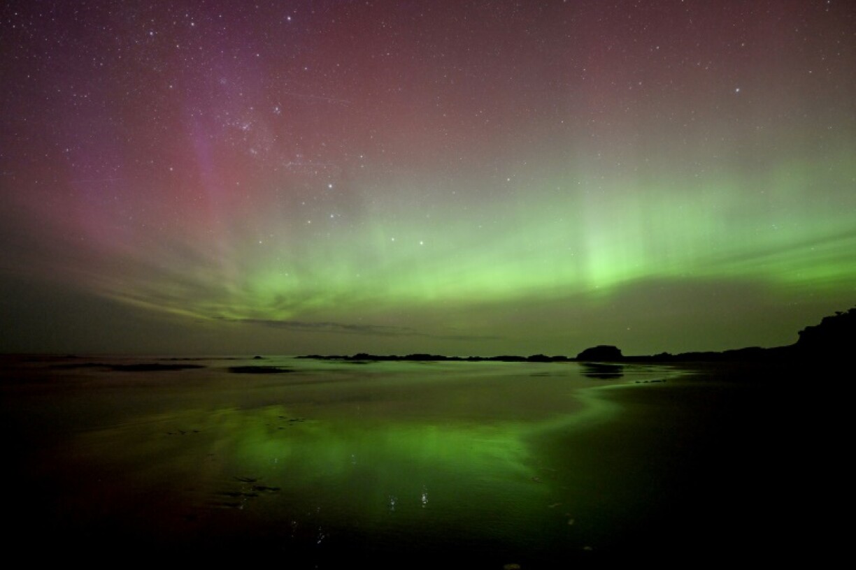 The Aurora Australis, also known as the Southern Lights, glows over a beach in Dunedin in New Zealand on November 13