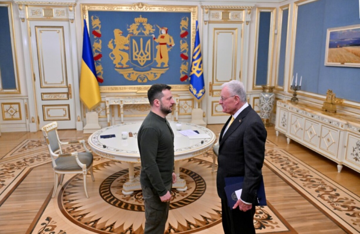 Ukraine's President Volodymyr Zelensky greets US special envoy for Ukraine Keith Kellogg at his offices in Kyiv on February 20, 2025