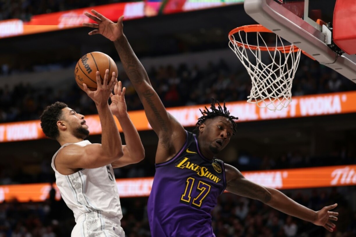 Quentin Grimes of the Dallas Mavericks makes a move to the basket against Dorian Finney-Smith in the Mavericks' NBA victory over the Los Angeles Lakers