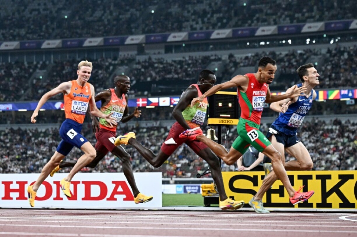Isaac Nader of Portugal dips to deny Britain's Jake Wightman gold in a tight finish to the men's 1,500m at the world championships
