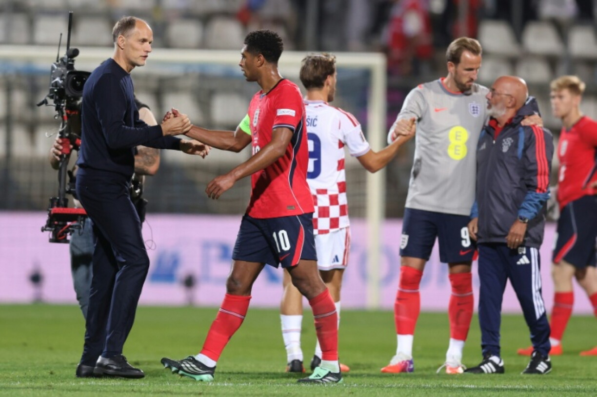 England boss Thomas Tuchel (L) celebrates his side's win over Croatia