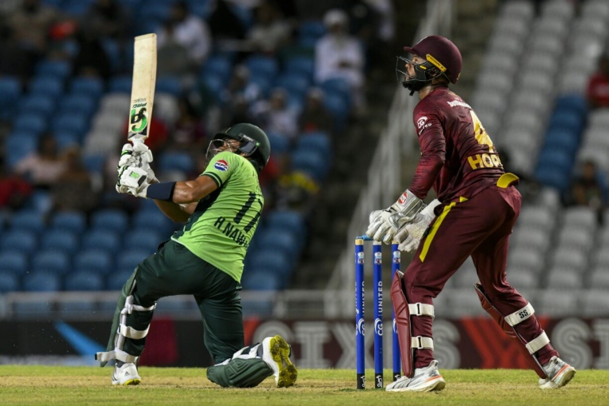 Pakistan's Hasan Nawaz, left, hits six as West Indies captain Shai Hope, right, watches in Pakistan's five-wicket ODI triumph over the West Indies