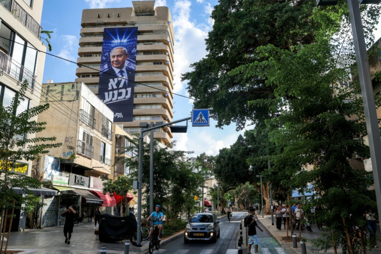 A giant electoral poster for Israeli Prime Minister Benjamin Netanyahu's Likud party with the slogan "no surrender" on the facade of a building in Tel Aviv
